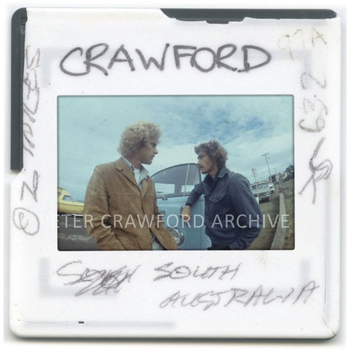 Terry Fitzgerald and Michael Peterson share a carpark moment in South Australia. Peter Crawford Archive.