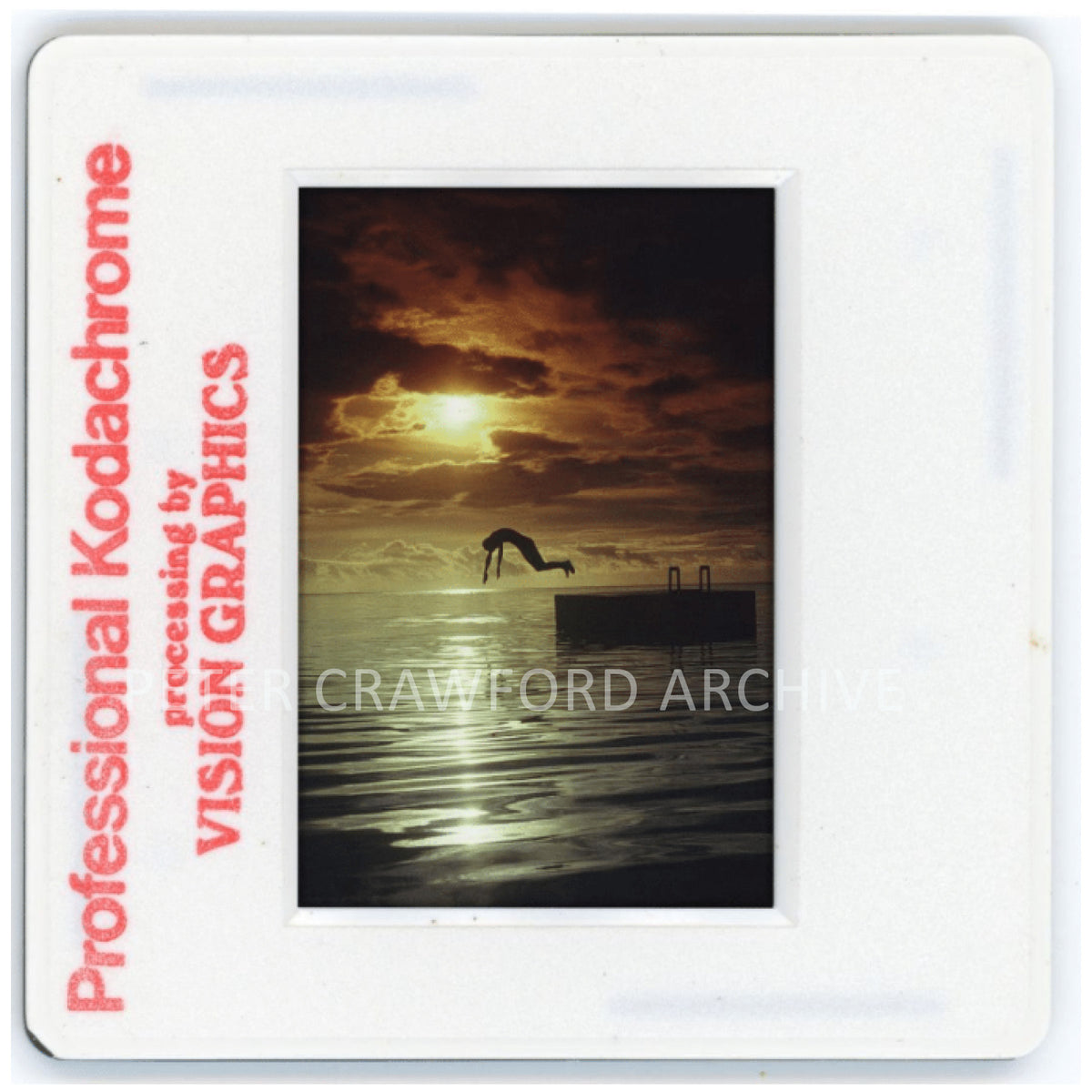 A dive held against sunset light, capturing a quiet moment from the Peter Crawford Archive. Peter Crawford Archive.