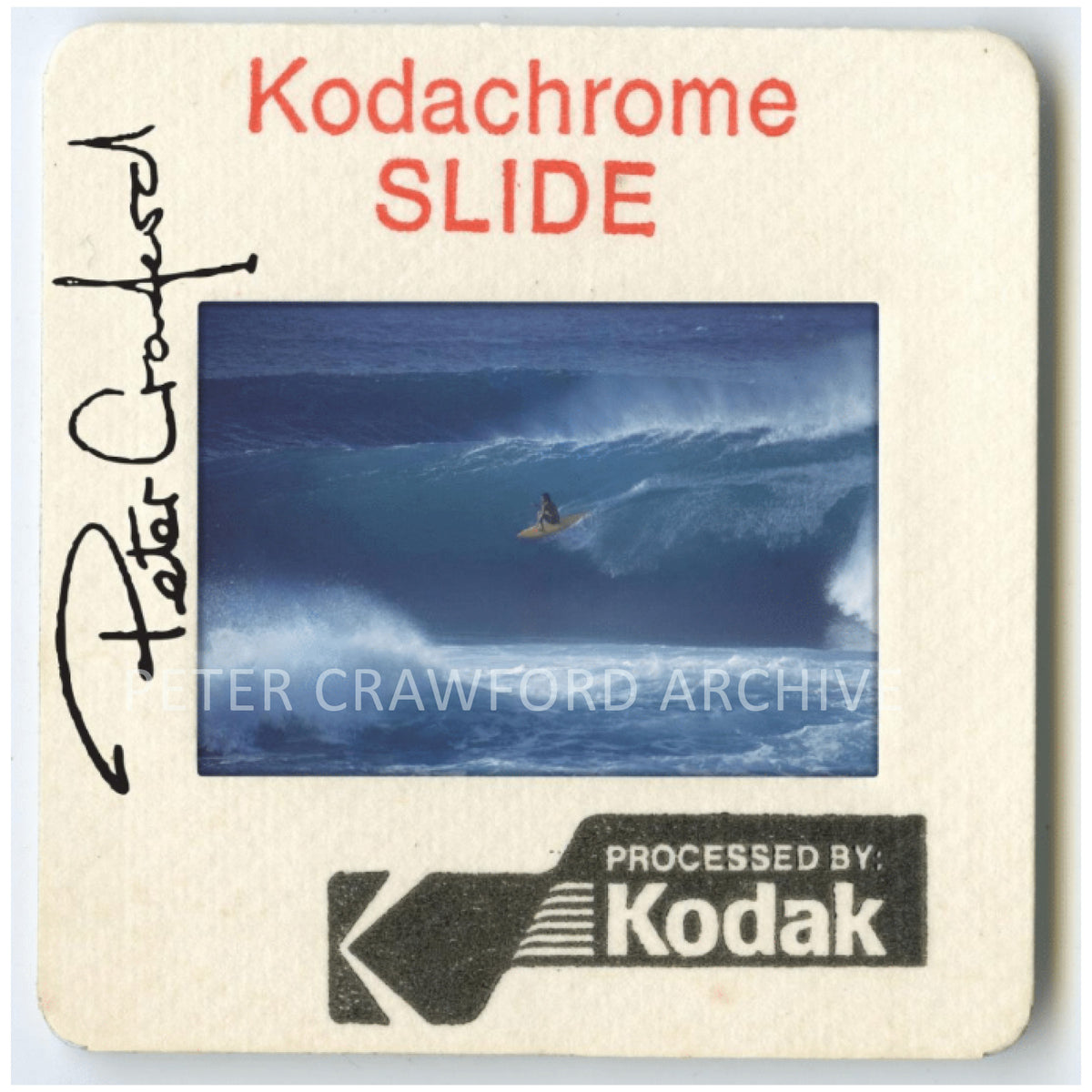 Jeff Hakman takes a high line at Sunset Beach on Oahu's North Shore. Peter Crawford Archive.