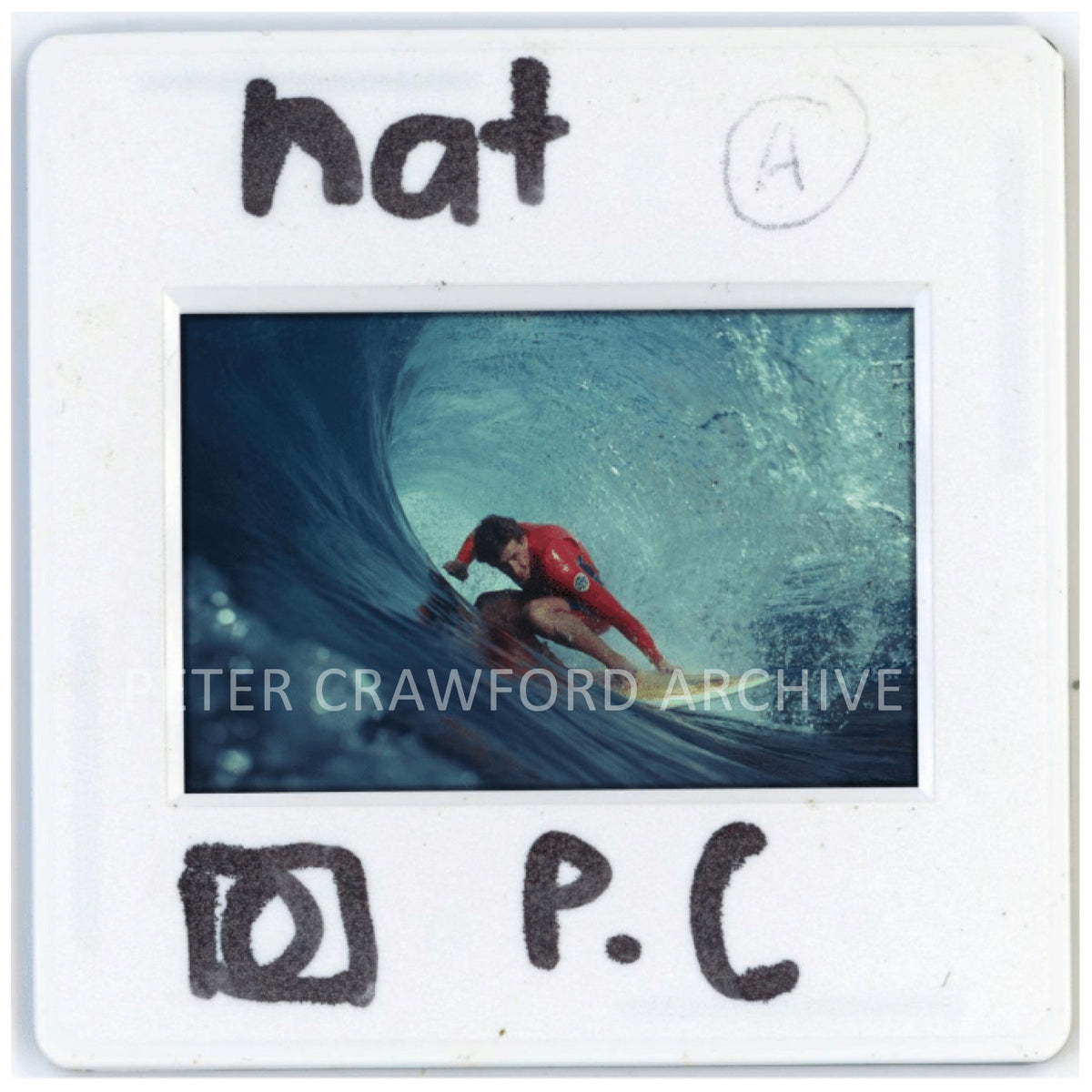 Nat Young rides a barrel at Dee Why Point, holding the outside rail as he sets his line. Peter Crawford Archive.