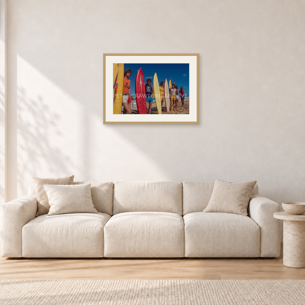 Pipe 76 Rory Russell Mike Armstrong Paul Naude by Peter Crawford — 60 × 40 cm, hayseed frame with white mat, shown in a light minimalist living room.