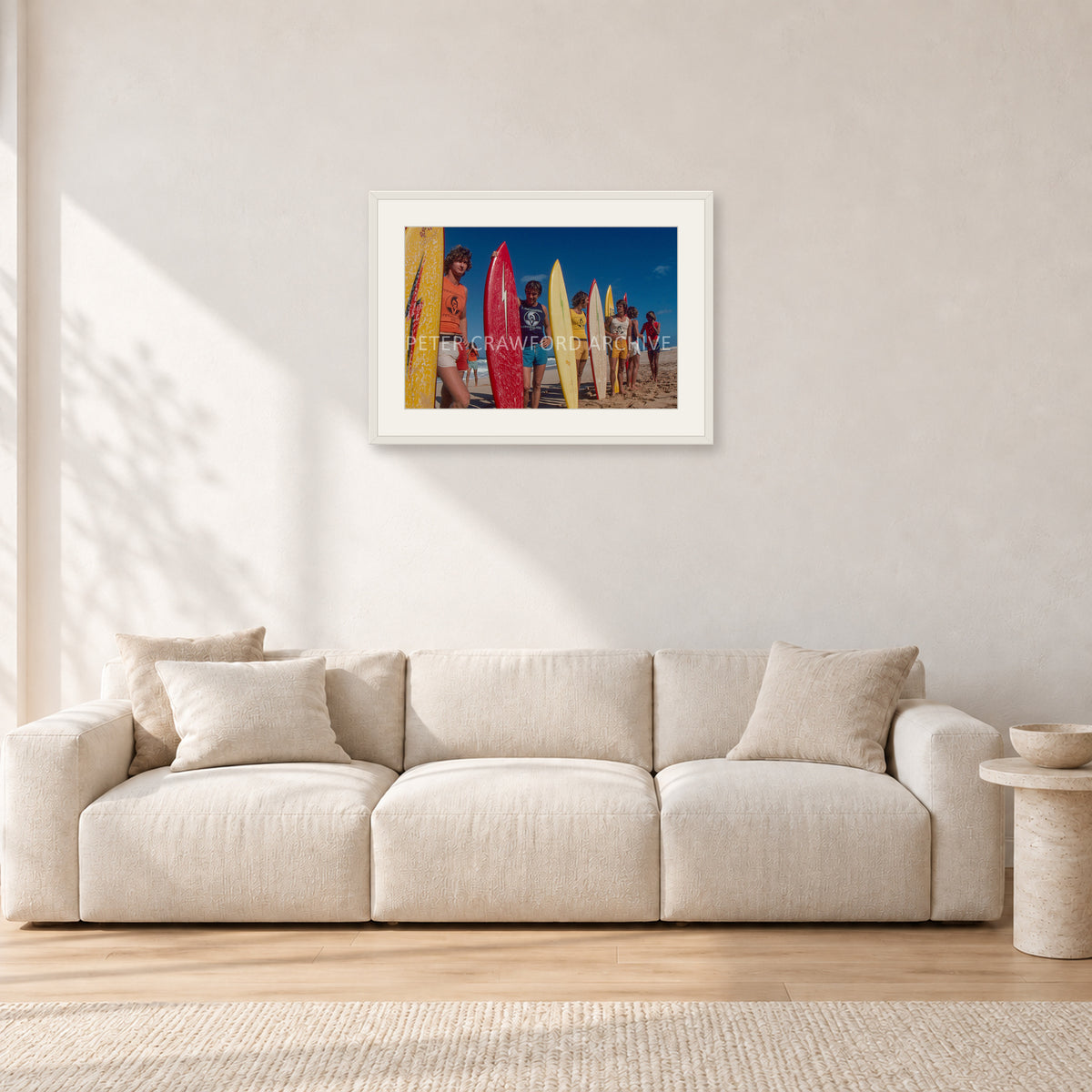 Pipe 76 Rory Russell Mike Armstrong Paul Naude by Peter Crawford — 60 × 40 cm, white frame with white mat, shown in a light minimalist living room.