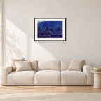 Pipe Final Crowd by Peter Crawford — 60 × 40 cm, black frame with white mat, shown in a light minimalist living room.