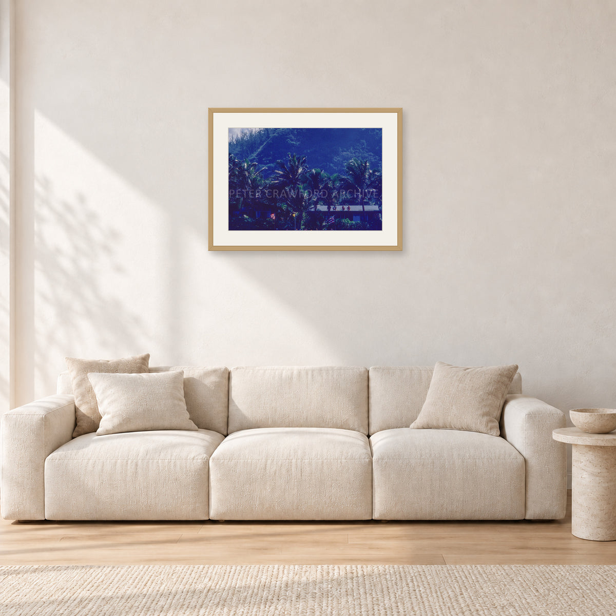 Pipe Final Crowd by Peter Crawford — 60 × 40 cm, hayseed frame with white mat, shown in a light minimalist living room.