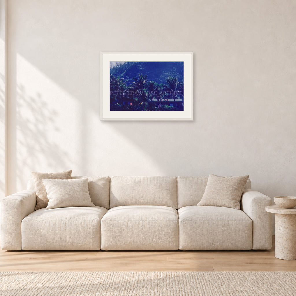 Pipe Final Crowd by Peter Crawford — 60 × 40 cm, white frame with white mat, shown in a light minimalist living room.