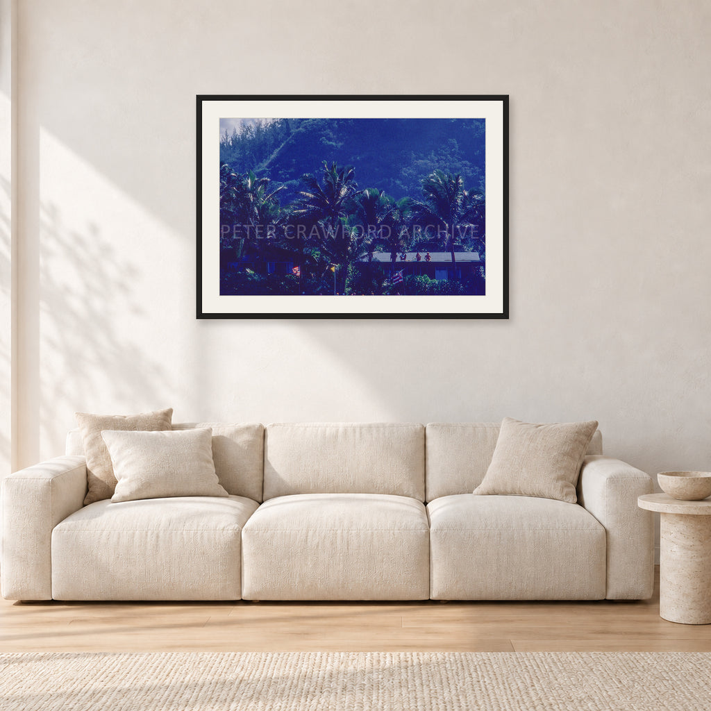 Pipe Final Crowd by Peter Crawford — 90 × 60 cm, black frame with white mat, shown in a light minimalist living room.
