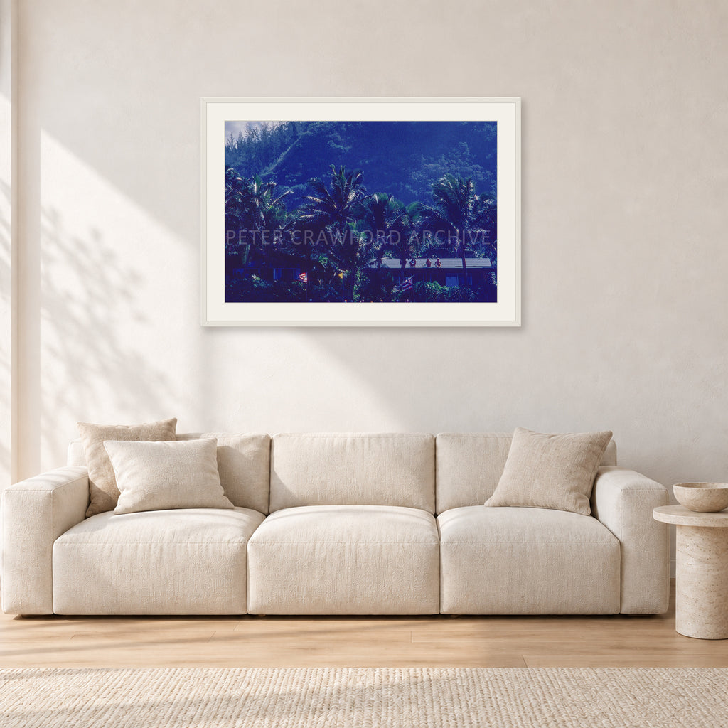 Pipe Final Crowd by Peter Crawford — 90 × 60 cm, white frame with white mat, shown in a light minimalist living room.