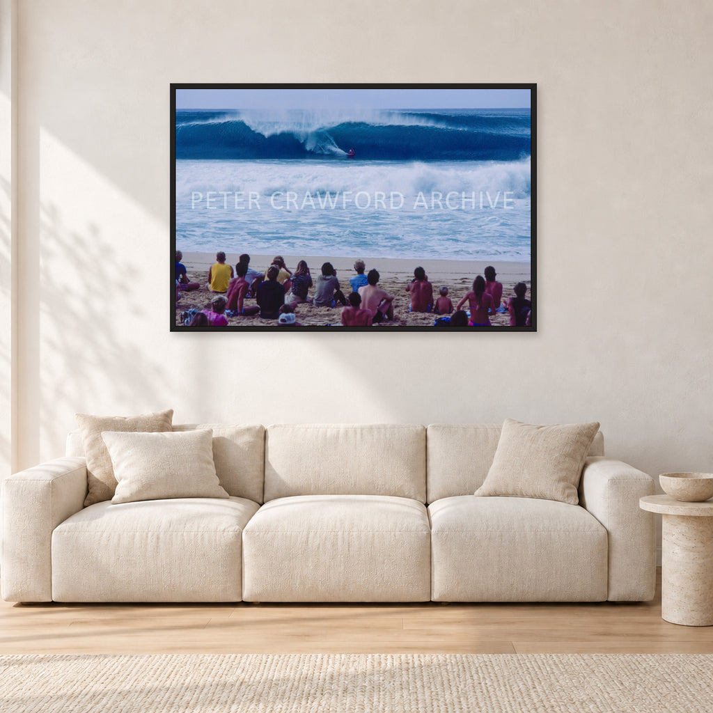 Pipe Masters, Pipeline 1988 by Peter Crawford — 120 × 80 cm, black frame, shown in a light minimalist living room.