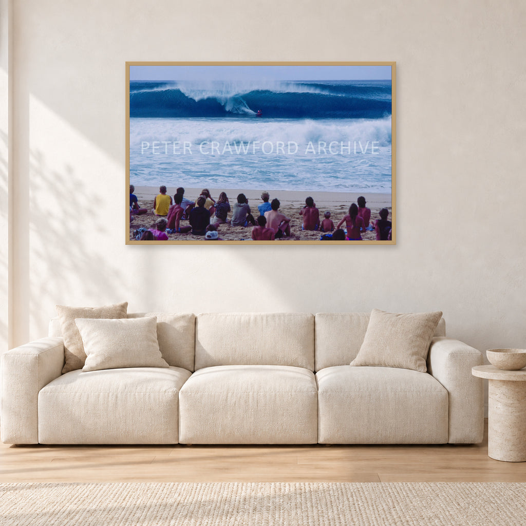 Pipe Masters, Pipeline 1988 by Peter Crawford — 120 × 80 cm, hayseed frame, shown in a light minimalist living room.