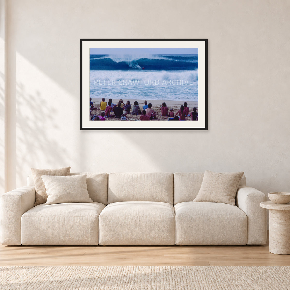 Pipe Masters, Pipeline 1988 by Peter Crawford — 90 × 60 cm, black frame with white mat, shown in a light minimalist living room.