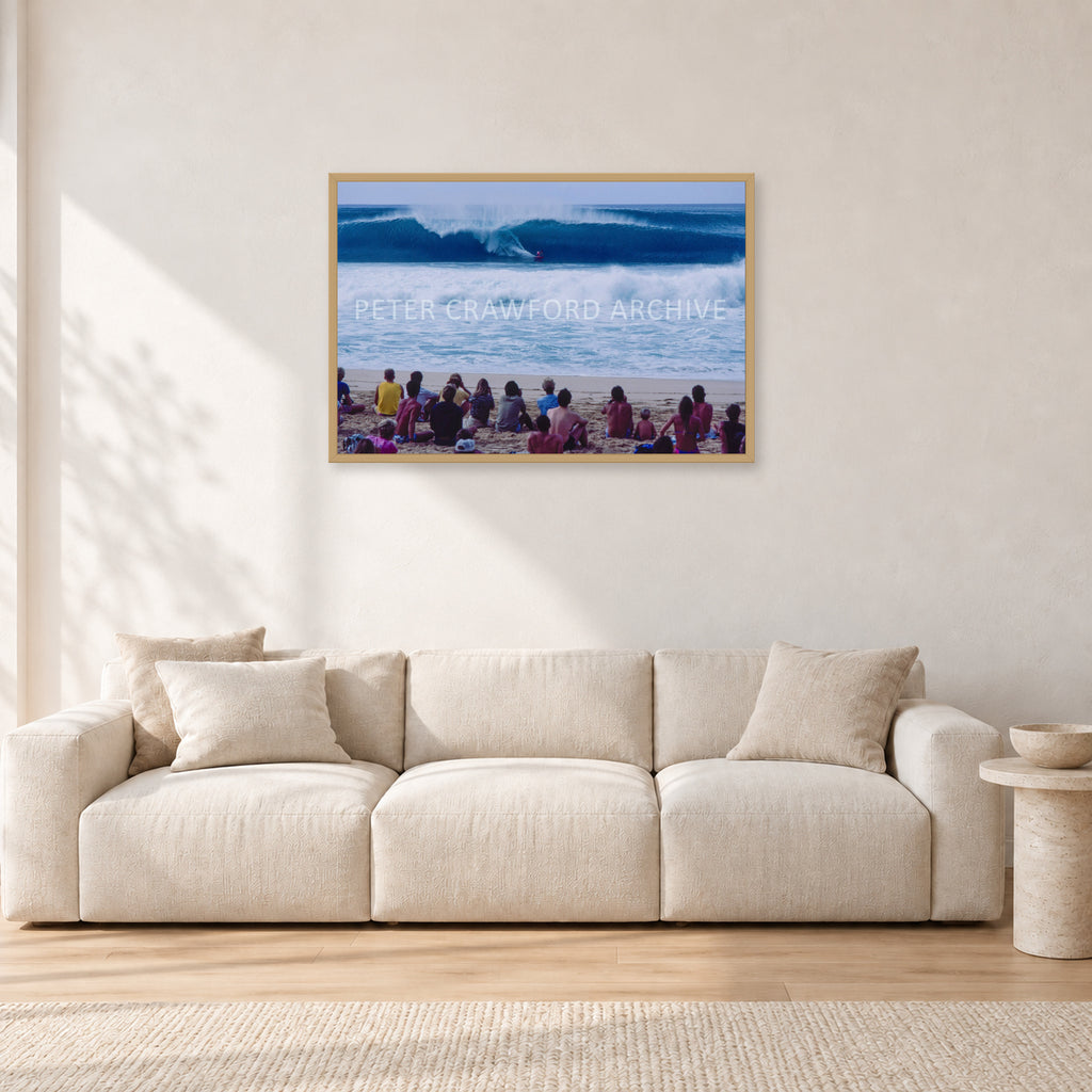 Pipe Masters, Pipeline 1988 by Peter Crawford — 90 × 60 cm, hayseed frame, shown in a light minimalist living room.