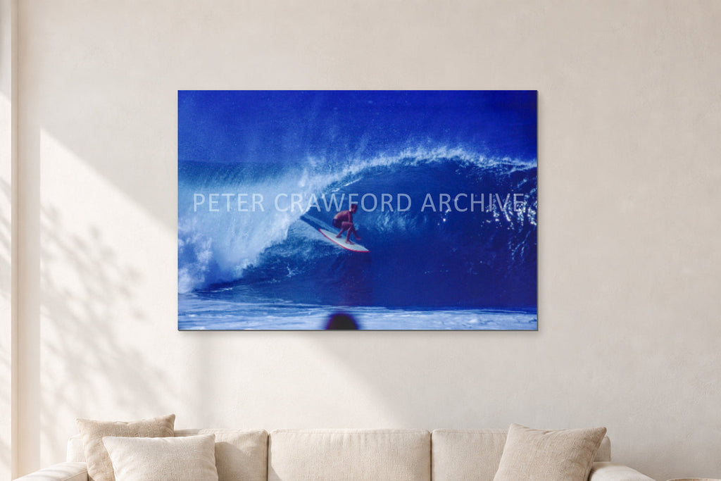 Pipeline, Hawaii by Peter Crawford — 120 × 80 cm, aluminium-mounted resin print, shown in a light minimalist living room.