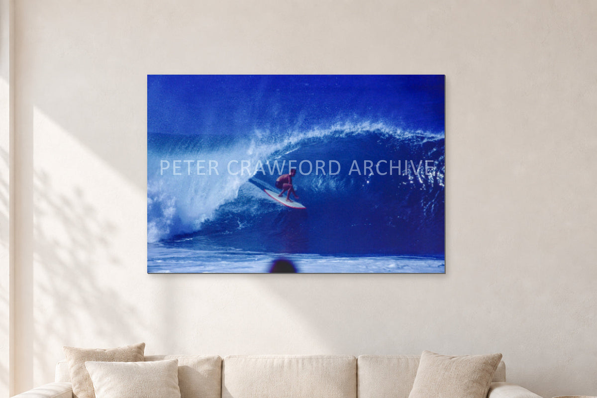 Pipeline, Hawaii by Peter Crawford — 120 × 80 cm, aluminium-mounted resin print, shown in a light minimalist living room.