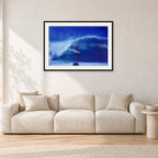 Pipeline, Hawaii by Peter Crawford — 90 × 60 cm, black frame with white mat, shown in a light minimalist living room.