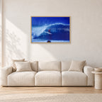 Pipeline, Hawaii by Peter Crawford — 90 × 60 cm, hayseed frame, shown in a light minimalist living room.