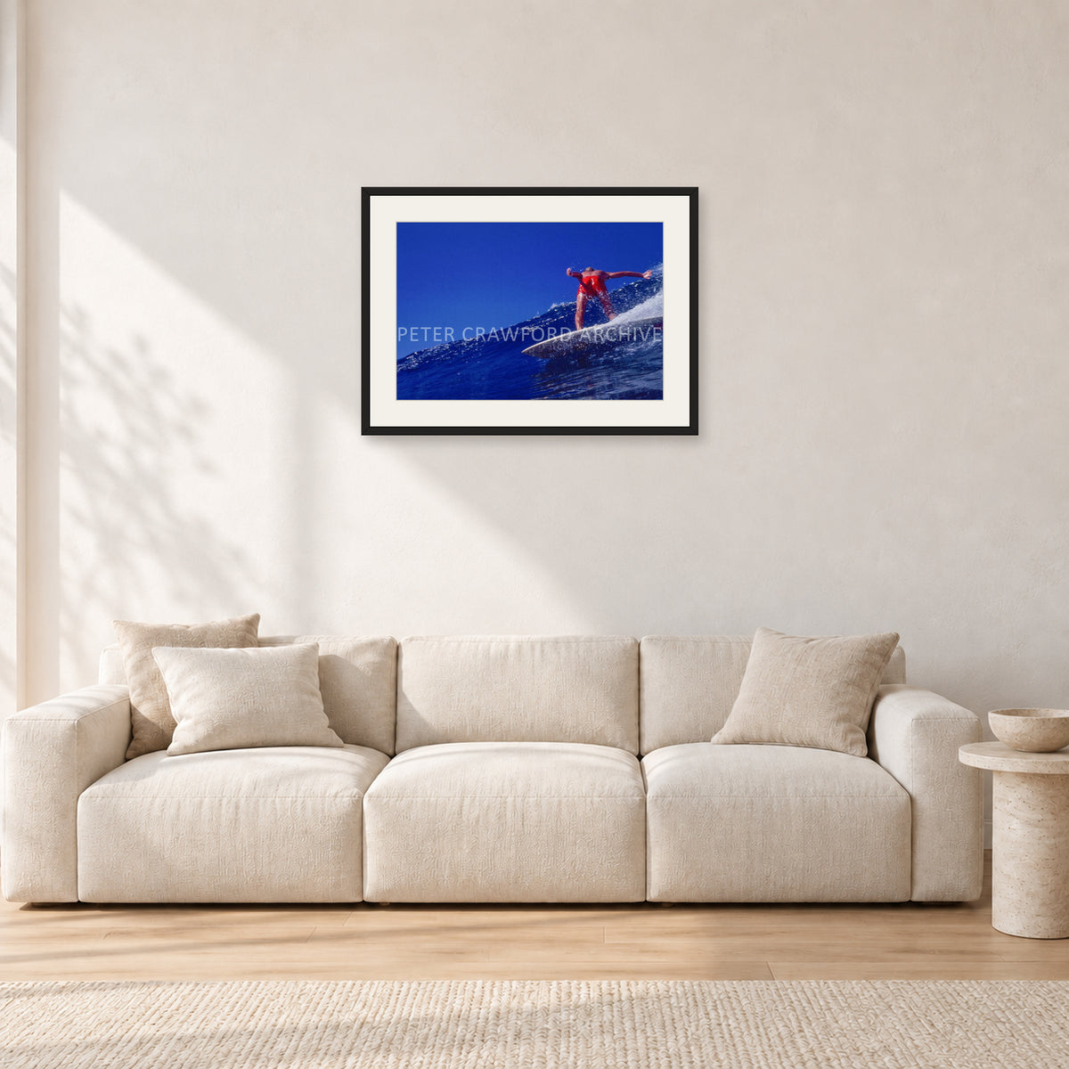 Rabbit Bartholomew, Stubbies 1978 by Peter Crawford — 60 × 40 cm, black frame with white mat, shown in a light minimalist living room.
