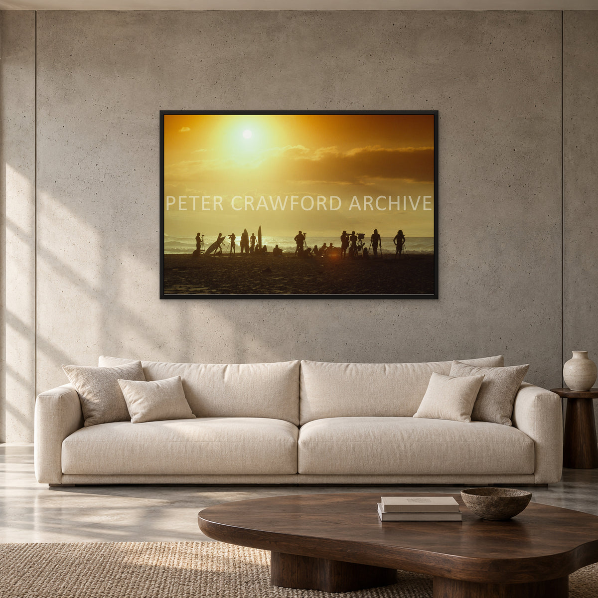 North Shore Sunset by Peter Crawford — 120 × 80 cm, black full frame, shown to scale in a contemporary concrete-wall living room.