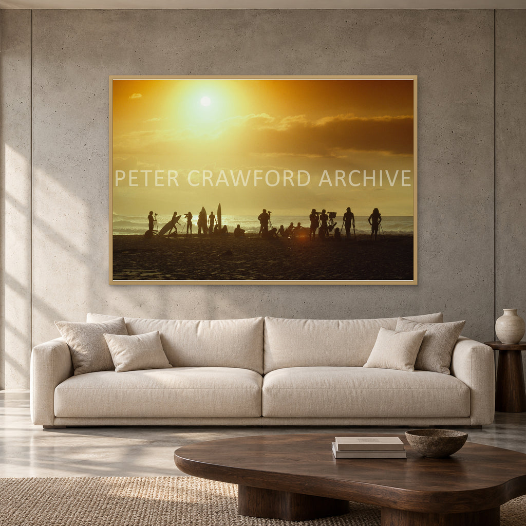 North Shore Sunset by Peter Crawford — 152 × 102 cm, hayseed full frame, shown to scale in a contemporary concrete-wall living room.