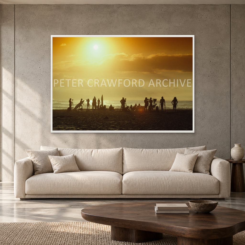 North Shore Sunset by Peter Crawford — 152 × 102 cm, white full frame, shown to scale in a contemporary concrete-wall living room.