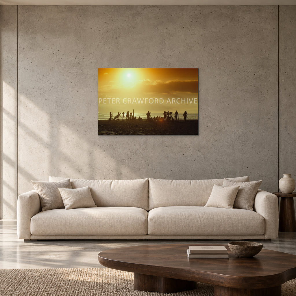 North Shore Sunset by Peter Crawford — 90 × 60 cm, aluminium resin mount, shown to scale in a contemporary concrete-wall living room.