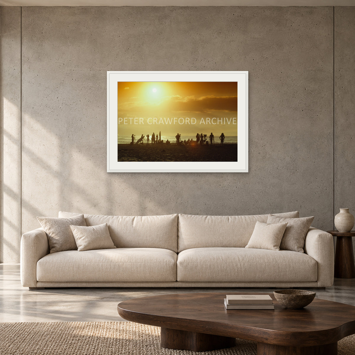 North Shore Sunset by Peter Crawford — 90 × 60 cm, white frame with mat, shown to scale in a contemporary concrete-wall living room.