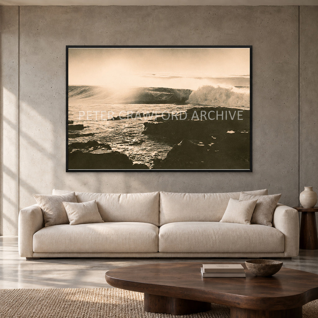 Peter Crawford Barrel at Dee Why — 152 × 102 cm, black full frame, shown in a contemporary concrete-wall living room.
