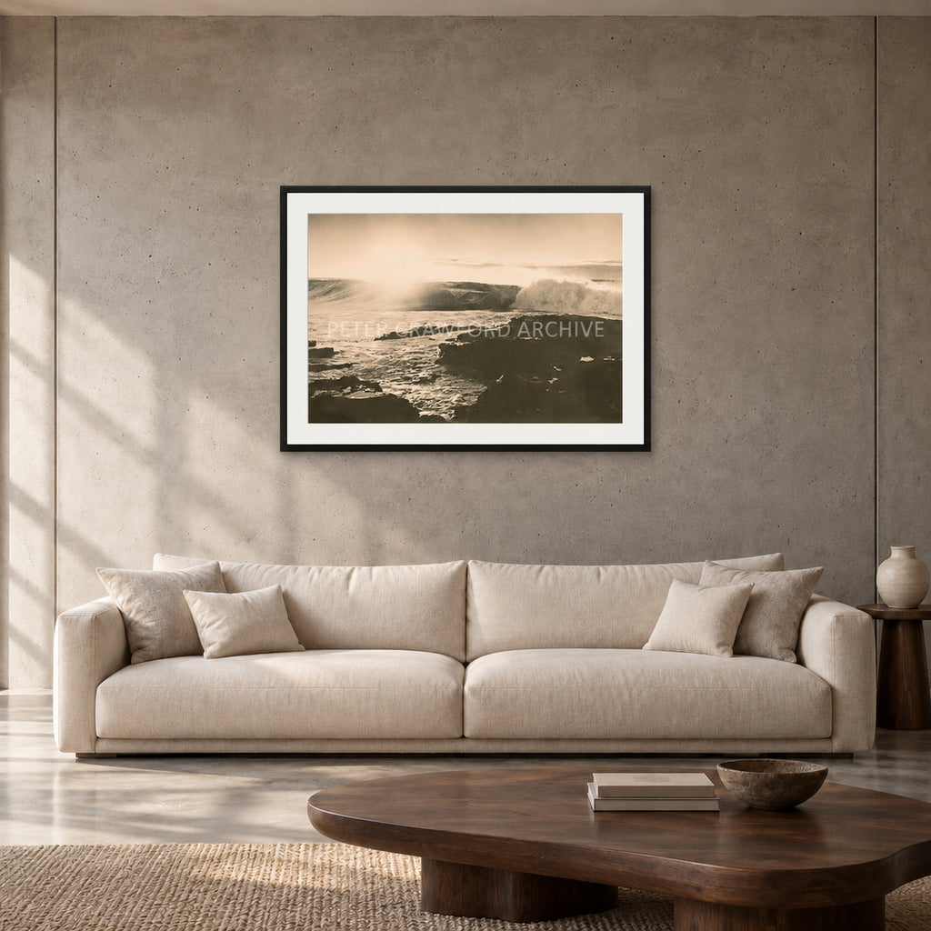 Peter Crawford Barrel at Dee Why — 90 × 60 cm, black frame with mat, shown in a contemporary concrete-wall living room.