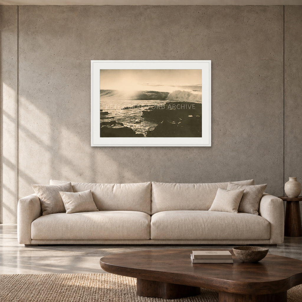 Peter Crawford Barrel at Dee Why — 90 × 60 cm, white frame with mat, shown in a contemporary concrete-wall living room.