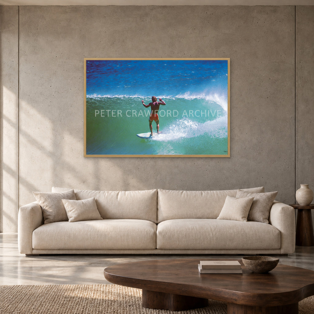 Terry Fitzgerald at Sunset Beach — 120 × 80 cm, hayseed full frame, shown in a contemporary concrete-wall living room.