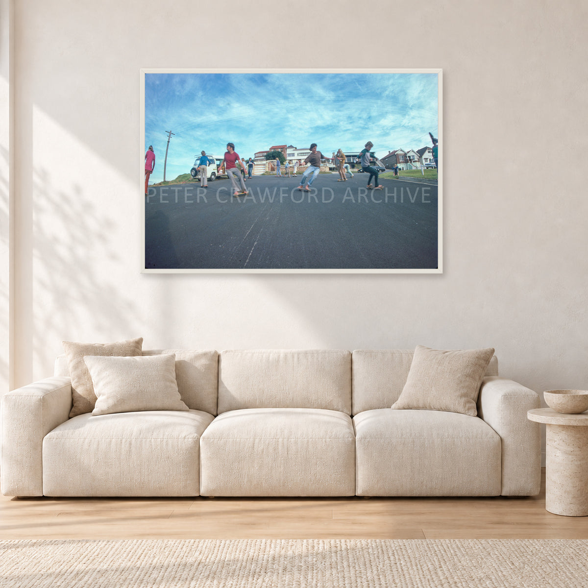Skate Rock n Roll DY 1977 by Peter Crawford — 120 × 80 cm, white frame, shown in a light minimalist living room.
