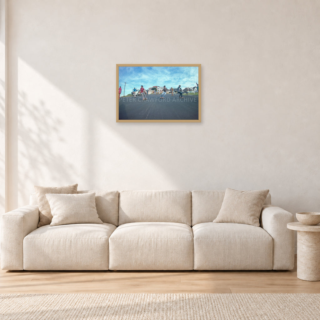 Skate Rock n Roll DY 1977 by Peter Crawford — 60 × 40 cm, hayseed frame, shown in a light minimalist living room.