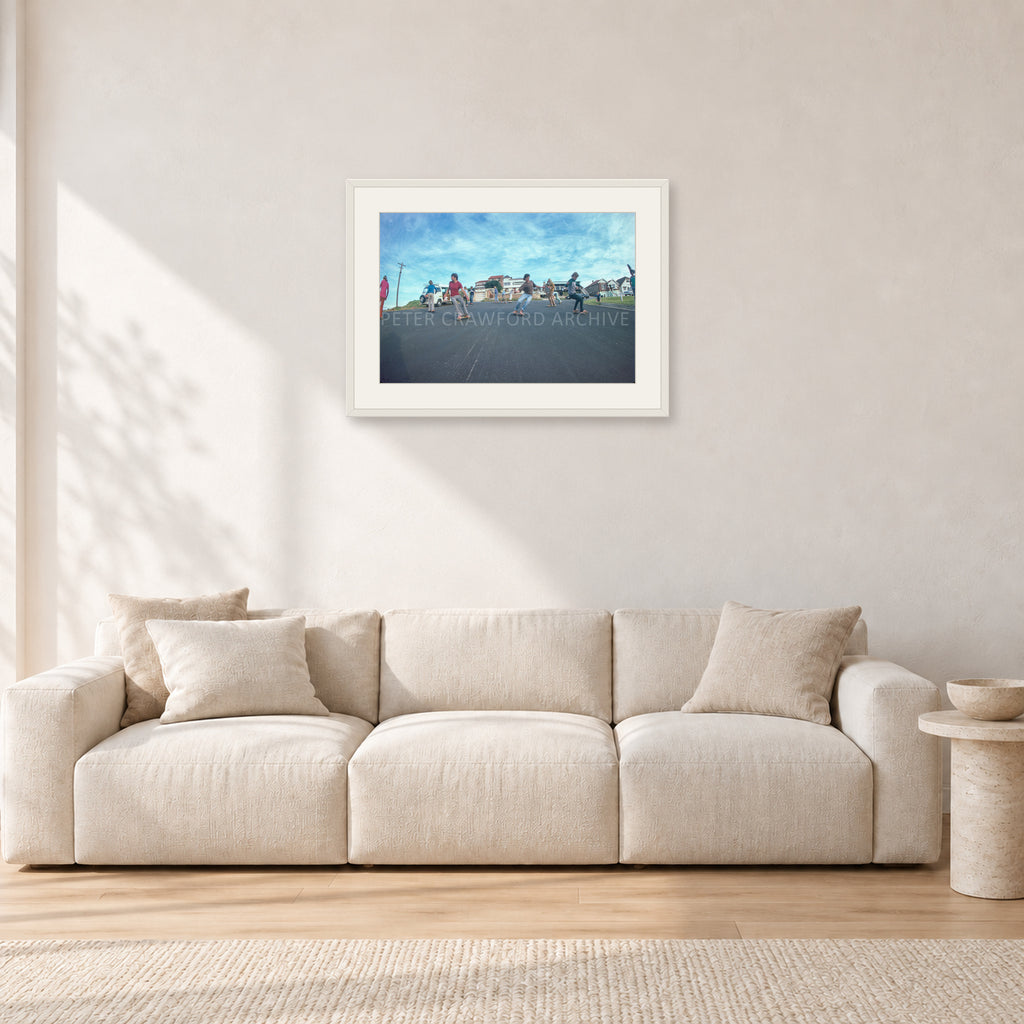 Skate Rock n Roll DY 1977 by Peter Crawford — 60 × 40 cm, white frame with white mat, shown in a light minimalist living room.