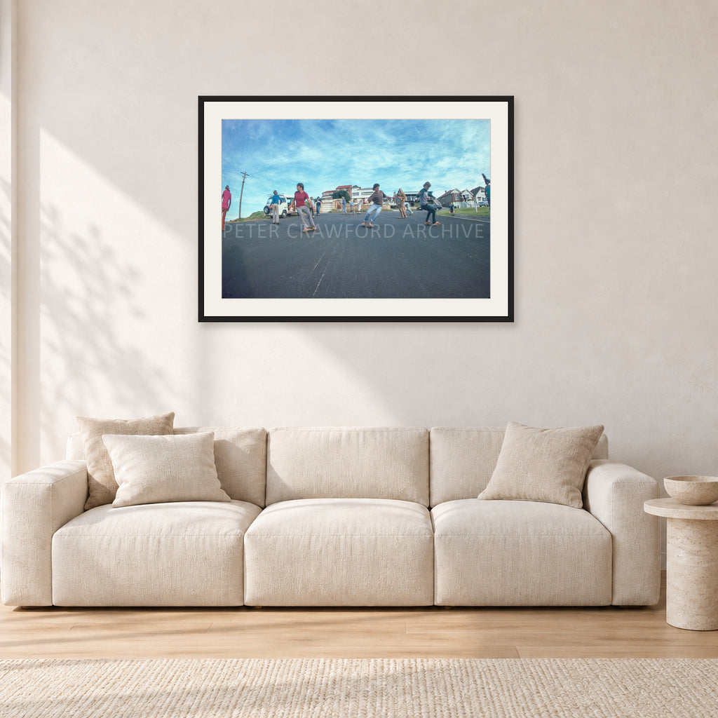 Skate Rock n Roll DY 1977 by Peter Crawford — 90 × 60 cm, black frame with white mat, shown in a light minimalist living room.