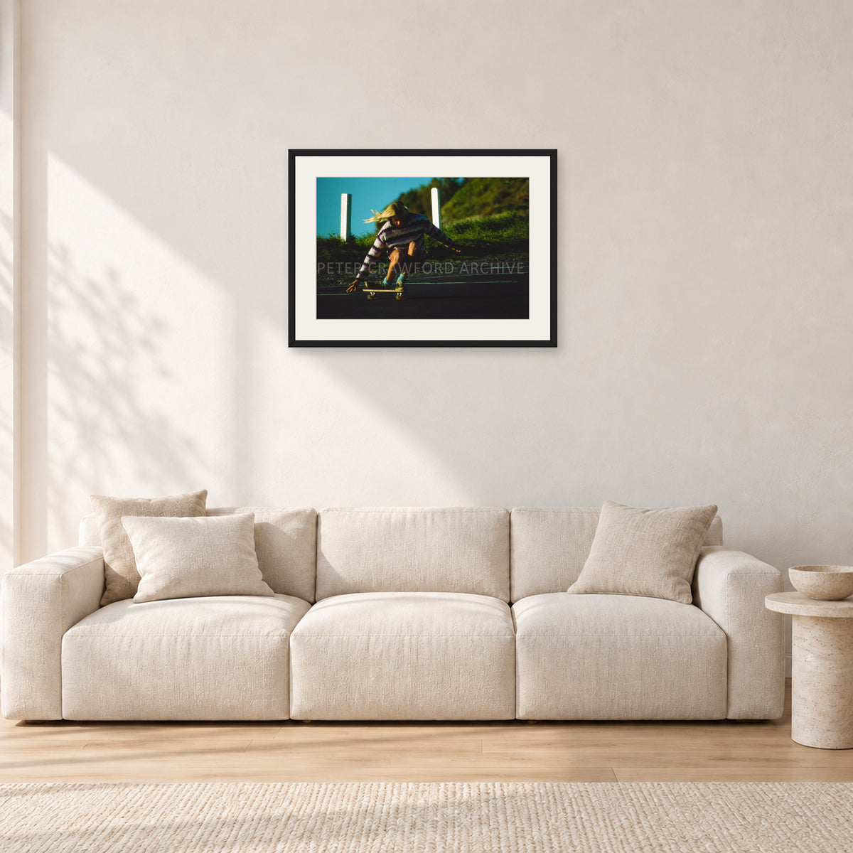 Russel Lewis Skate DY by Peter Crawford — 60 × 40 cm, black frame with white mat, shown in a light minimalist living room.