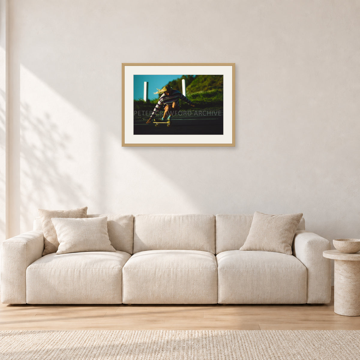 Russel Lewis Skate DY by Peter Crawford — 60 × 40 cm, hayseed frame with white mat, shown in a light minimalist living room.