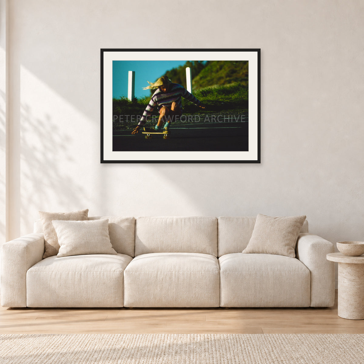 Russel Lewis Skate DY by Peter Crawford — 90 × 60 cm, black frame with white mat, shown in a light minimalist living room.