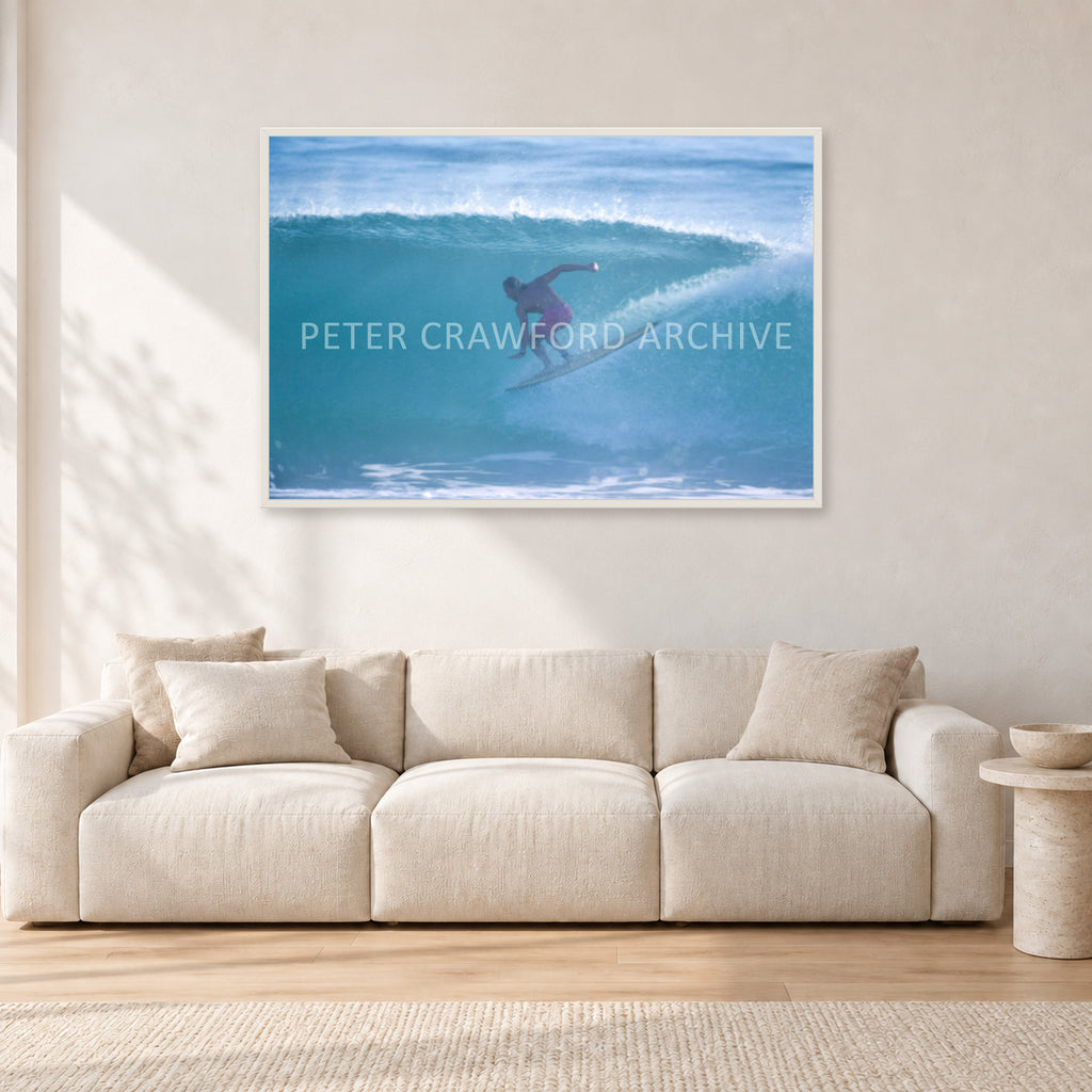 Russell L, Surf Study by Peter Crawford — 120 × 80 cm, white frame, shown in a light minimalist living room.