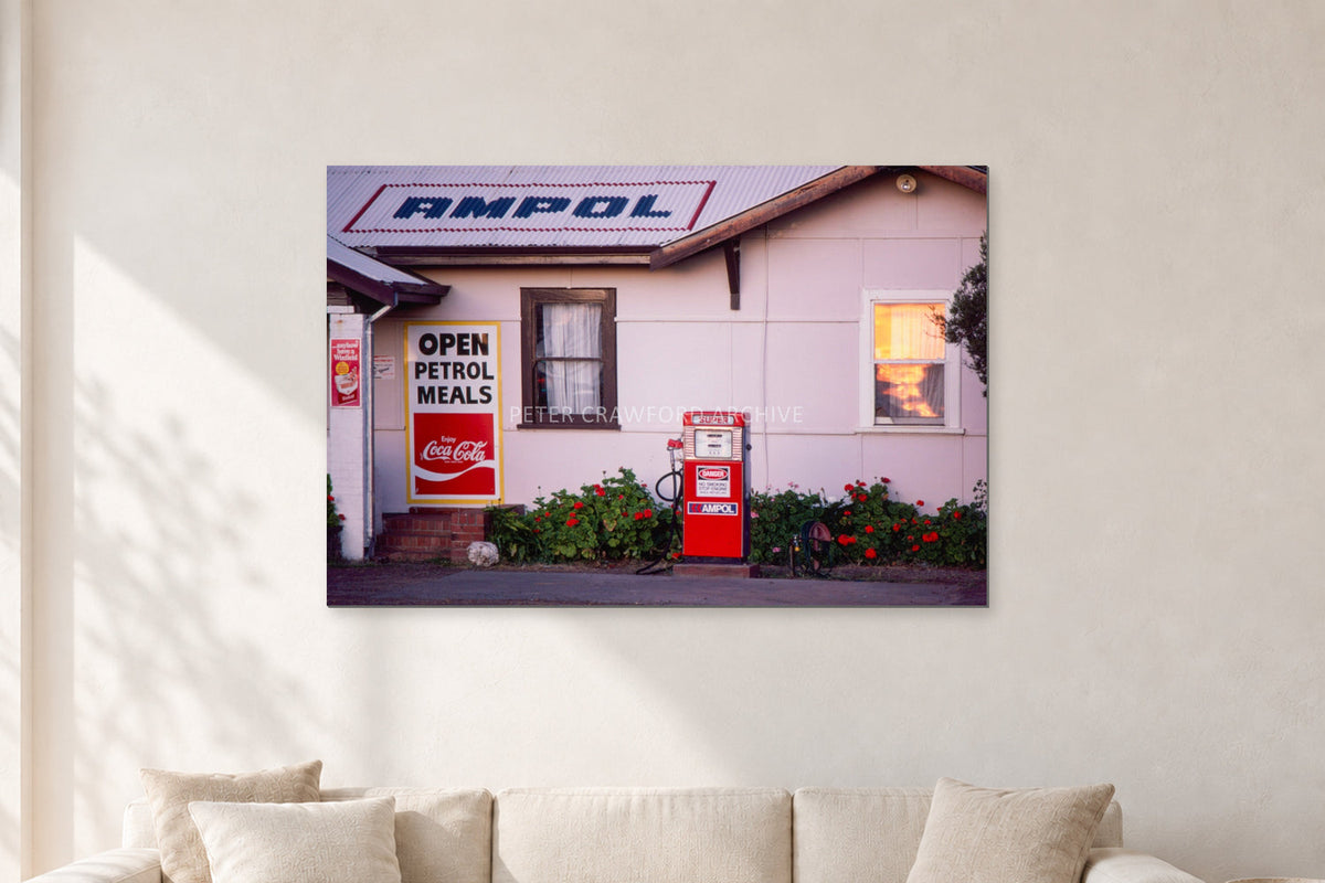 Seventies Petrol Station, 1970 by Peter Crawford — 120 × 80 cm, aluminium-mounted resin print, shown in a light minimalist living room.