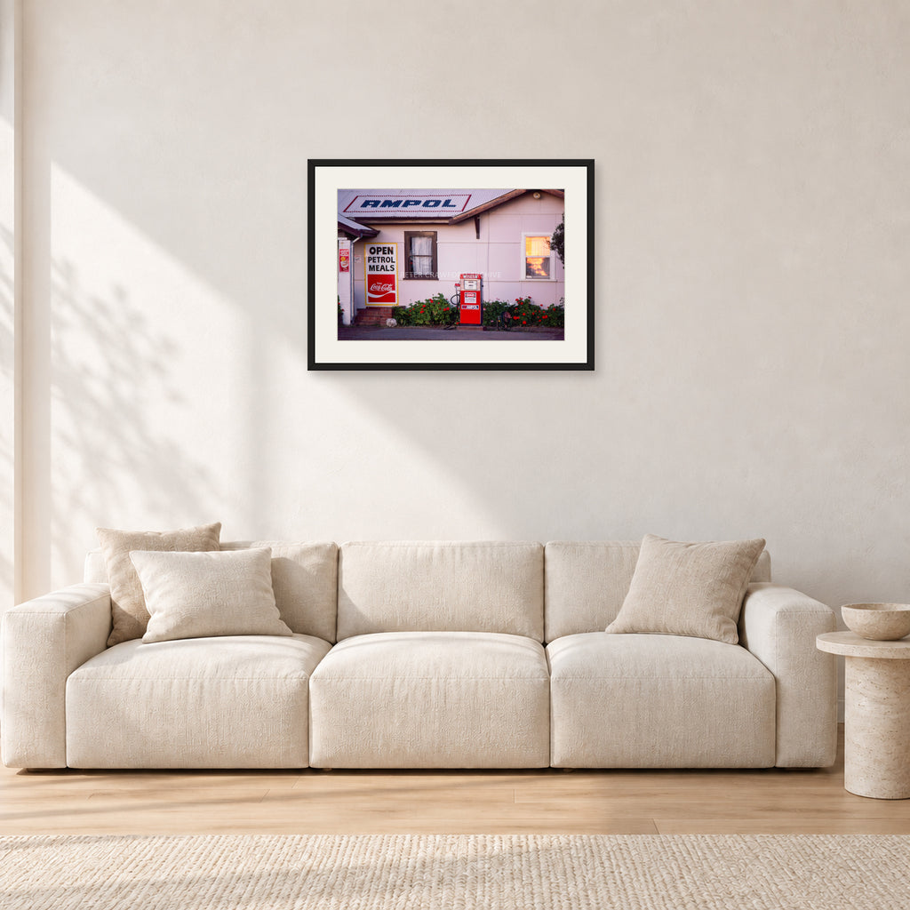 Seventies Petrol Station, 1970 by Peter Crawford — 60 × 40 cm, black frame with white mat, shown in a light minimalist living room.