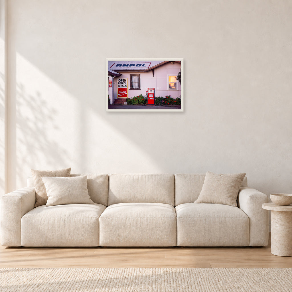 Seventies Petrol Station, 1970 by Peter Crawford — 60 × 40 cm, white frame, shown in a light minimalist living room.