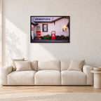 Seventies Petrol Station, 1970 by Peter Crawford — 90 × 60 cm, black frame, shown in a light minimalist living room.