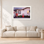 Seventies Petrol Station, 1970 by Peter Crawford — 90 × 60 cm, white frame with white mat, shown in a light minimalist living room.