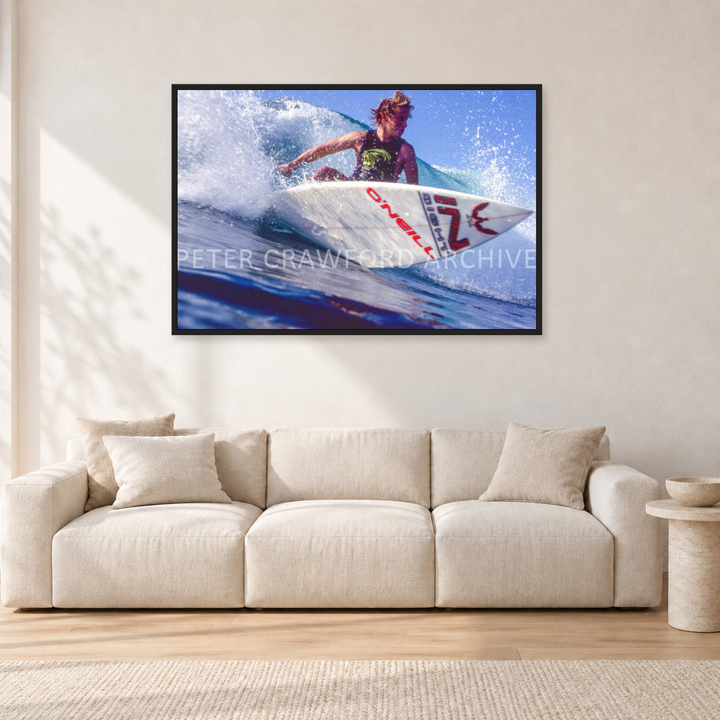 Shane Herring, Dee Why Point 1989 by Peter Crawford — 120 × 80 cm, black frame, shown in a light minimalist living room.