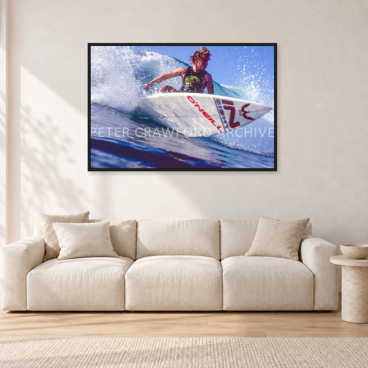 Shane Herring, Dee Why Point 1989 by Peter Crawford — 120 × 80 cm, black frame, shown in a light minimalist living room.