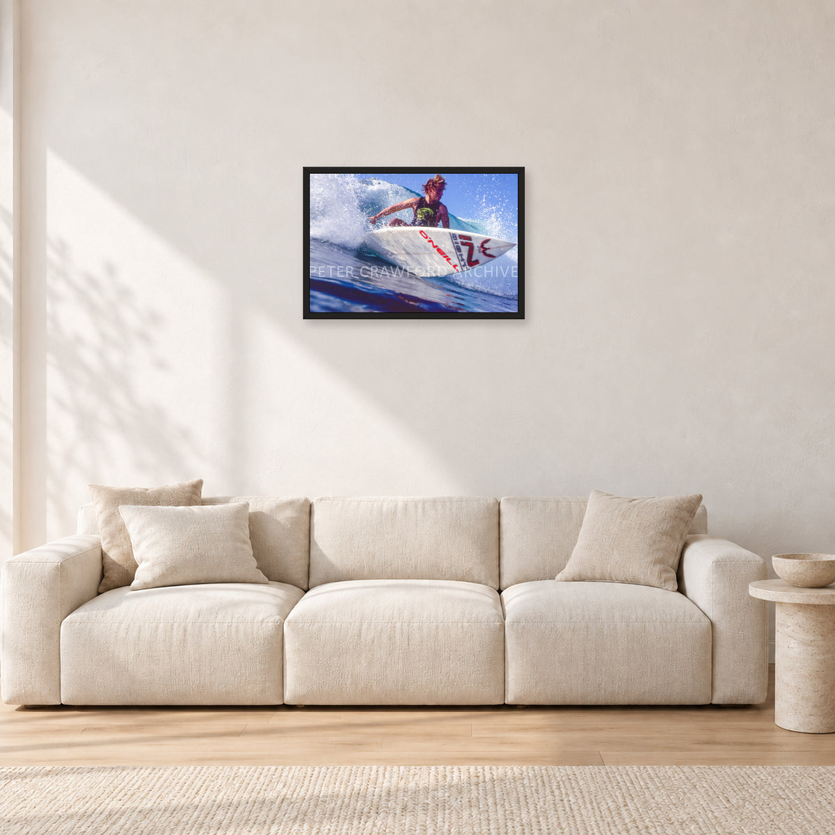 Shane Herring, Dee Why Point 1989 by Peter Crawford — 60 × 40 cm, black frame, shown in a light minimalist living room.