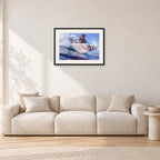 Shane Herring, Dee Why Point 1989 by Peter Crawford — 60 × 40 cm, black frame with white mat, shown in a light minimalist living room.