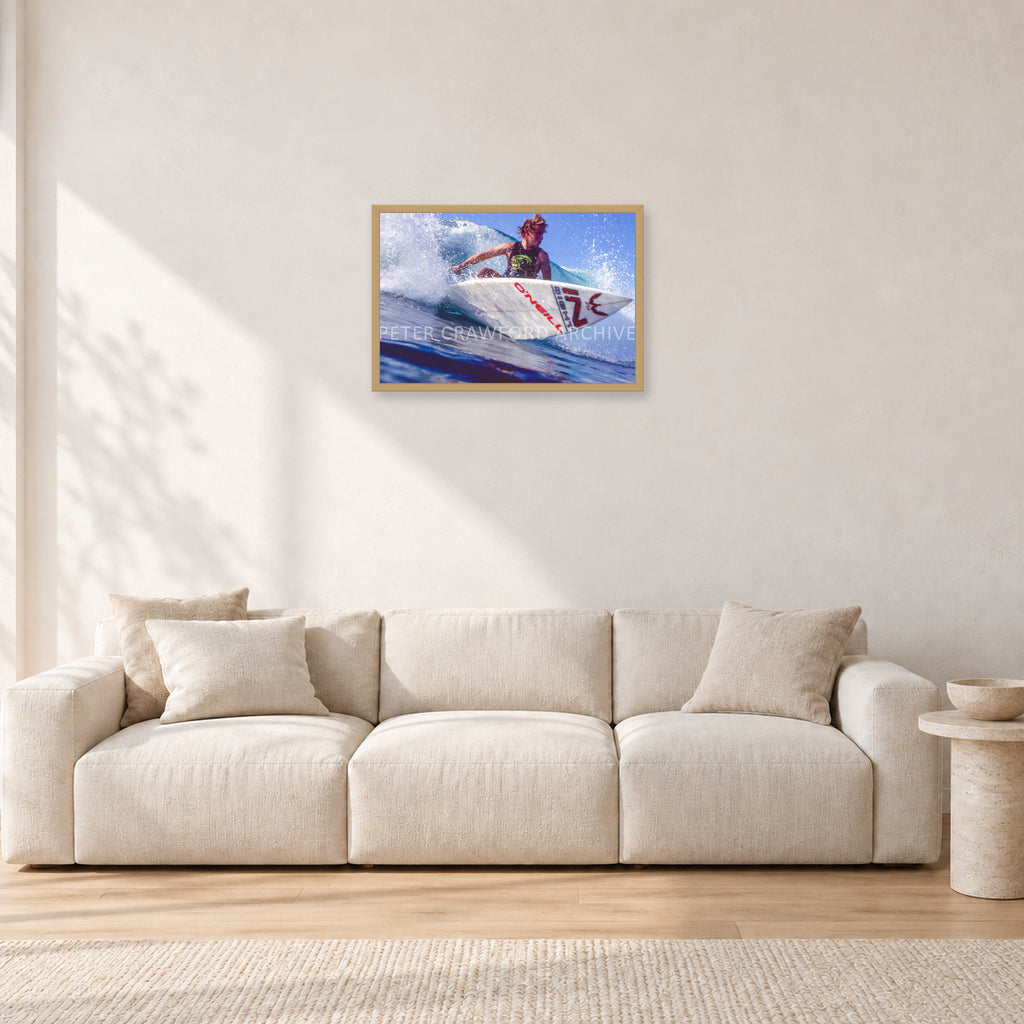 Shane Herring, Dee Why Point 1989 by Peter Crawford — 60 × 40 cm, hayseed frame, shown in a light minimalist living room.