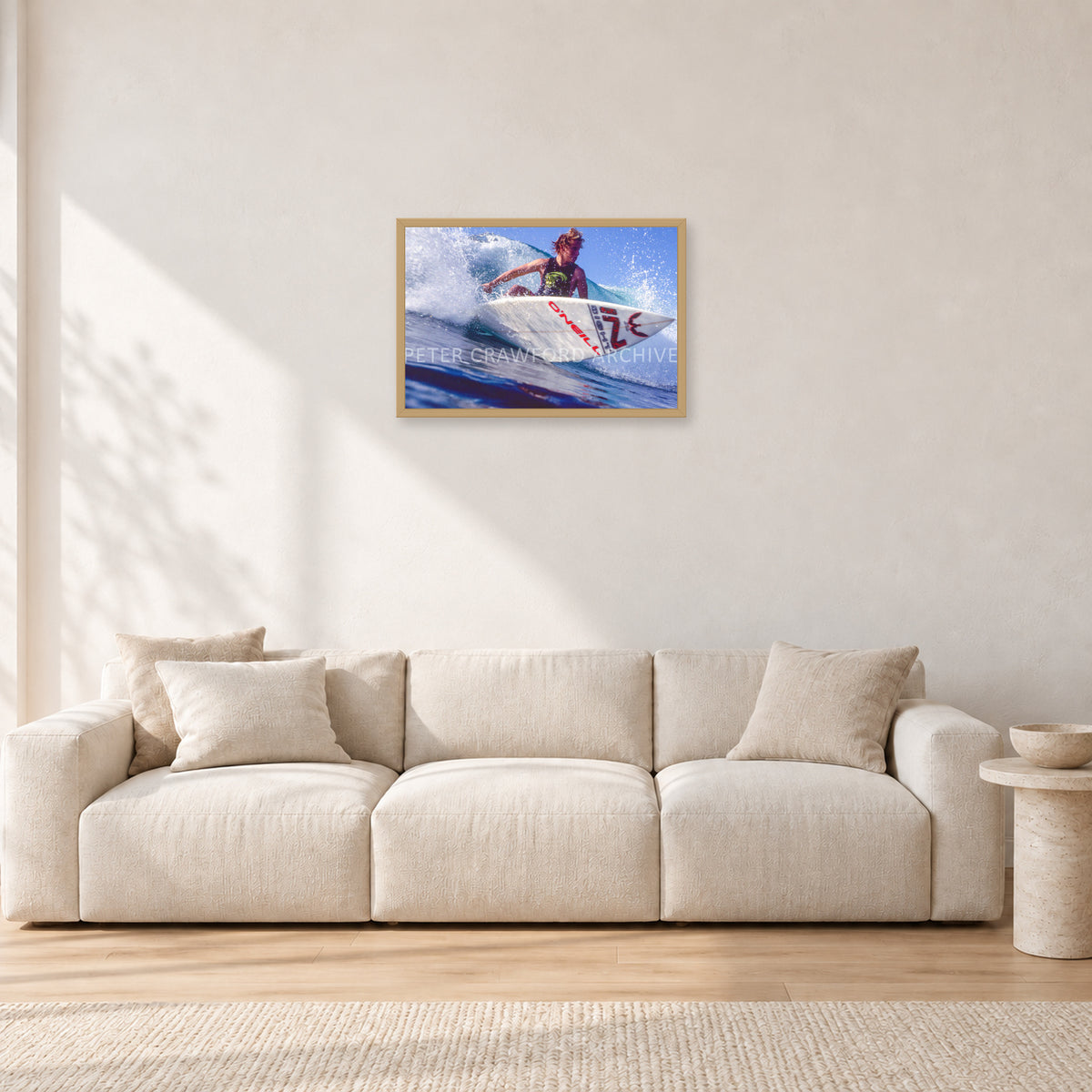 Shane Herring, Dee Why Point 1989 by Peter Crawford — 60 × 40 cm, hayseed frame, shown in a light minimalist living room.