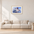 Shane Herring, Dee Why Point 1989 by Peter Crawford — 60 × 40 cm, hayseed frame with white mat, shown in a light minimalist living room.