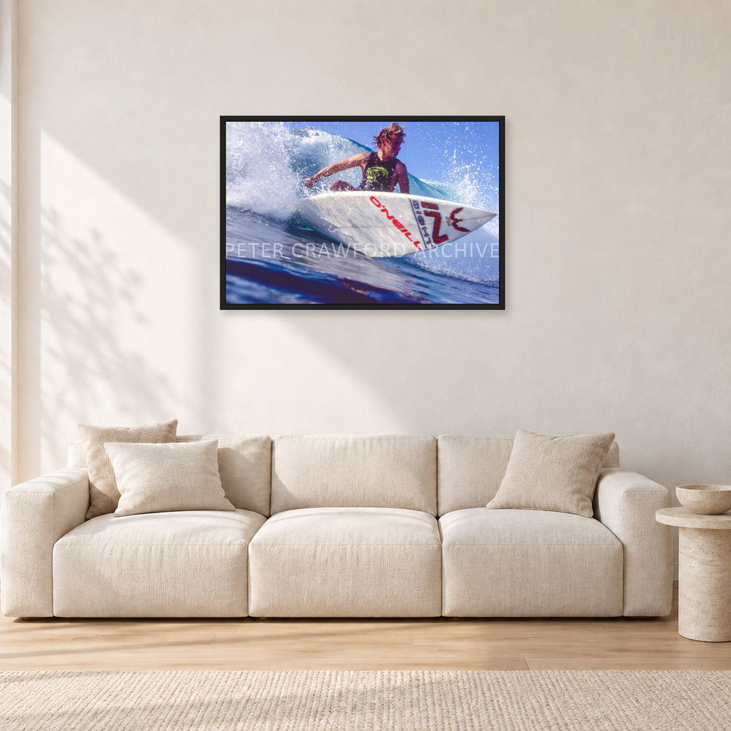 Shane Herring, Dee Why Point 1989 by Peter Crawford — 90 × 60 cm, black frame, shown in a light minimalist living room.
